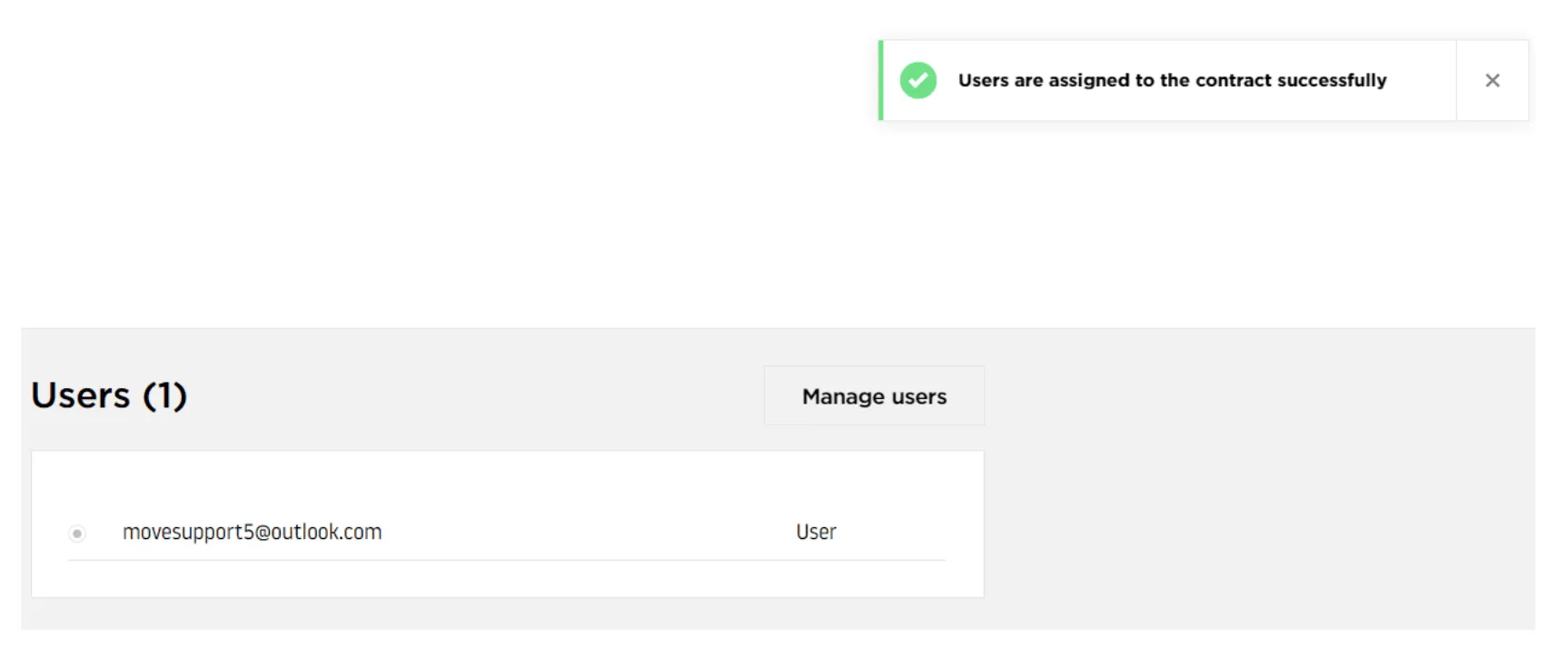 Green success notification banner in upper-right corner displaying message 'User has been assigned to contract successfully'